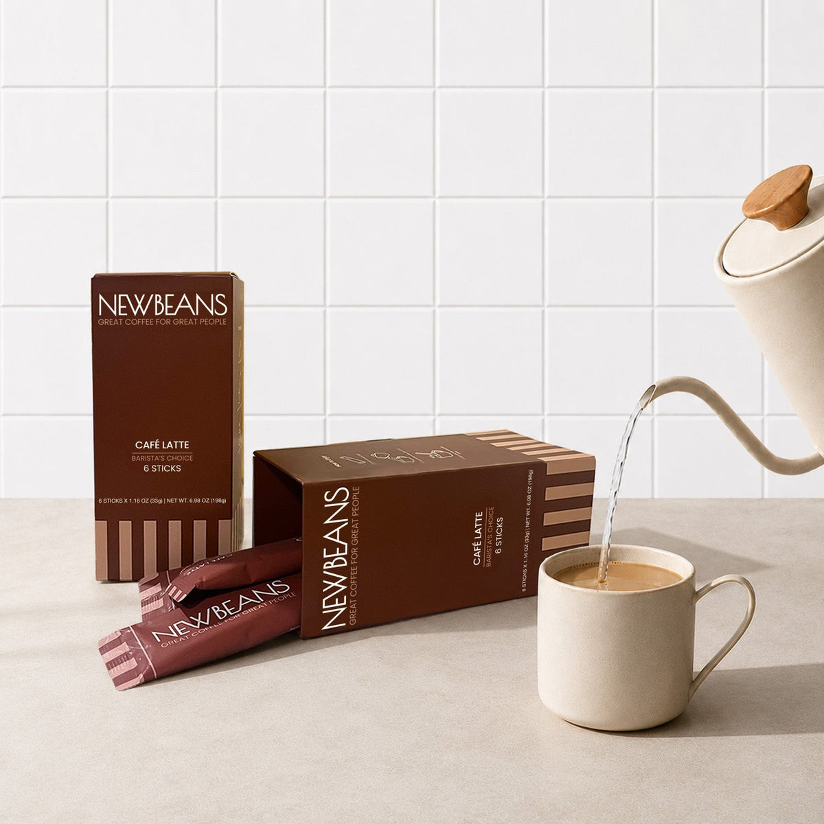 Newbeans Café Latte box on a kitchen counter beside a freshly poured latte
